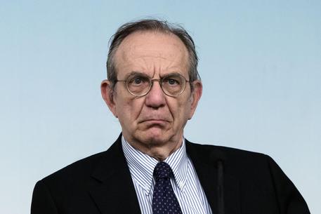 Italian Economy Minister Pier Carlo Padoan during the press conference in Chigi Palace after the adoption of economic and financial document (DEF), Rome, 10 April 2015. Experts at the economy ministry and the premier's office have freed up some 1.6 billion euros in extra funding for the measures in the executive's economic and financial document (DEF), government sources said Friday. Premier Matteo Renzi wants the extra funding - which his office is calling a "bonus" - to be allocated to welfare spending, reportedly via special decree. Economy Minister Pier Carlo Padoan and his team have liberated the extra funding through a kind of "reverse deficit adjustment", thanks to new European Union rules on budget flexibility. ANSA/ ANGELO CARCONI